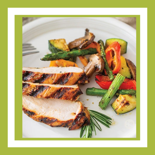 Sliced Rustic Grilled Turkey tenderloin served with grilled asparagus, zucchini, peppers and mushrooms for a light dinner.